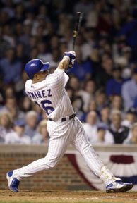 Kenny Lofton of the Chicago Cubs is congratulated by Eric Karros