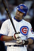 Kenny Lofton of the Chicago Cubs is congratulated by Eric Karros