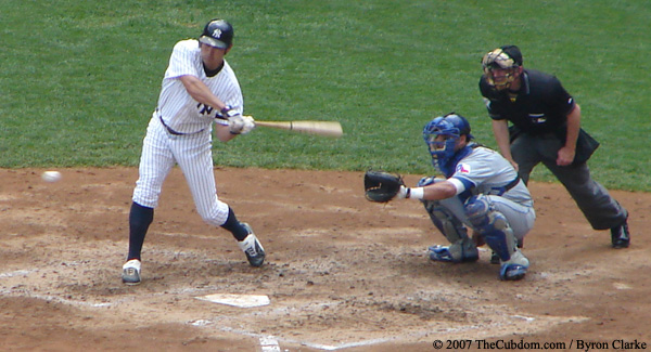 Johnny Damon swings at a strike